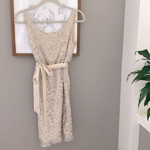 Sequin and lace cocktail dress with silk bow